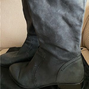 Used good condition tall leather black boots from Nine West.